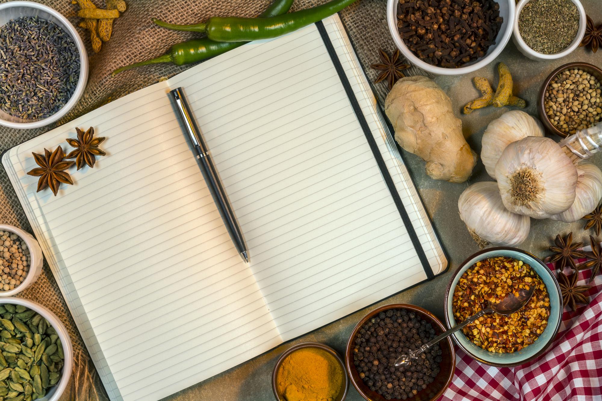 Studio counter with open notebooks, herbs and tasting notes
