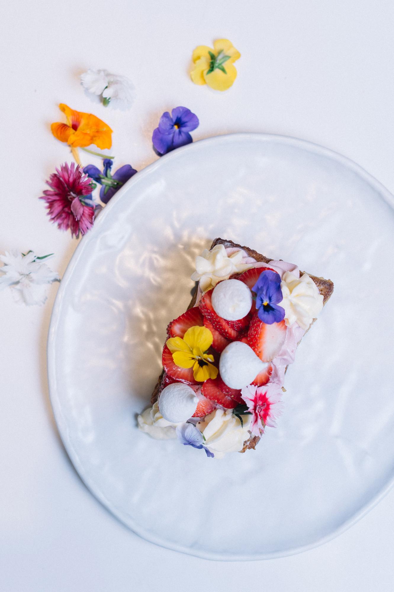 Close-up of plated dessert with edible flowers